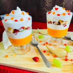 A picture of Orange jelly with creamy fruit delight.
