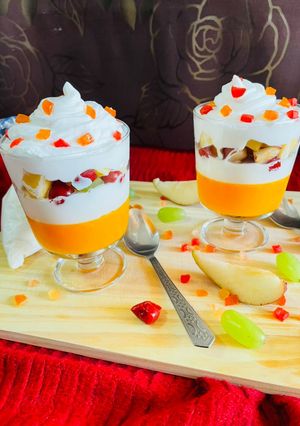 A picture of Orange jelly with creamy fruit delight.