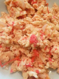 A picture of Eggs with tomatoes.