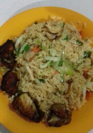 A picture of Coconut rice with Stir fry veges and chicken.