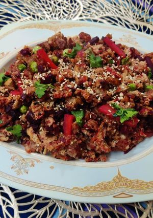 A picture of Bread Upma with beetroot & sesame seeds.