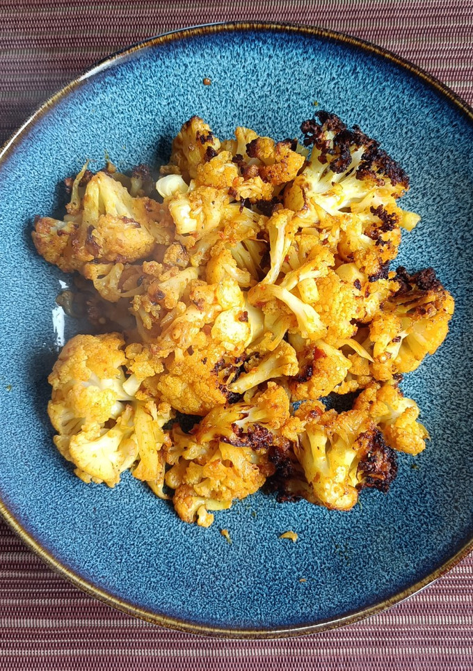 Una foto de Coliflor con cúrcuma en air-fryer