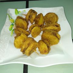 A picture of Meat stuffed potato pakora.