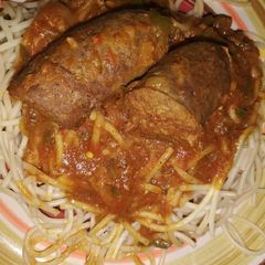 A picture of Spaghetti and relish with wors.