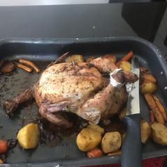 A picture of Roast chicken with vegetables.