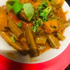 A picture of Drumsticks pumpkin sweet sour curry.