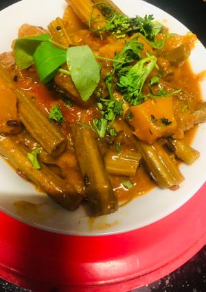 A picture of Drumsticks pumpkin sweet sour curry.