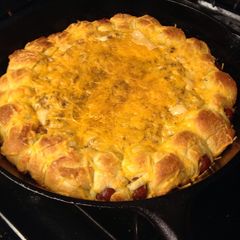A picture of Chili dogs in a blanket.