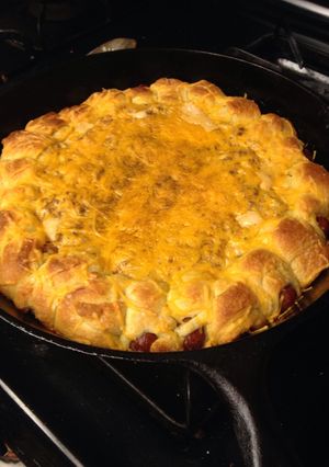 A picture of Chili dogs in a blanket.