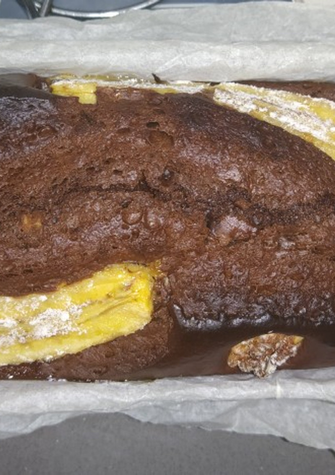 Una foto de Bizcocho de plátano, cacao y nueces en mambo