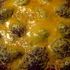A picture of Meatballs in marinara sauce.