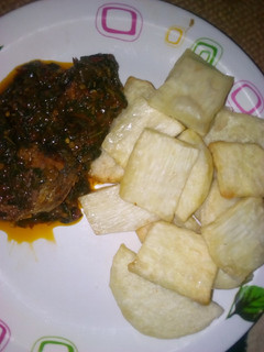 A picture of Fried yam with vegetable sauce.