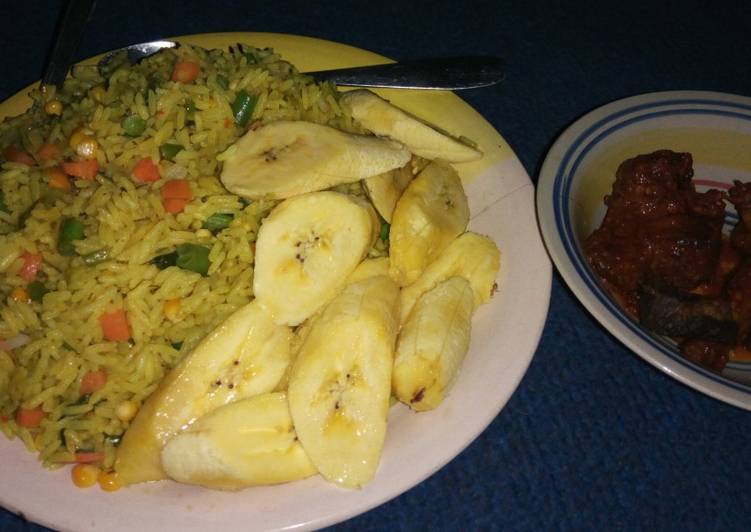 Fried rice, plantain with peppered meat
