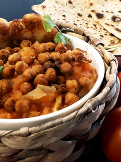 Una foto de Garbanzos crujientes en curry de tomates