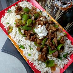 A picture of Beef chilli dry with fried rice.