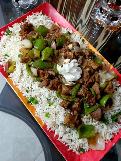 A picture of Beef chilli dry with fried rice.