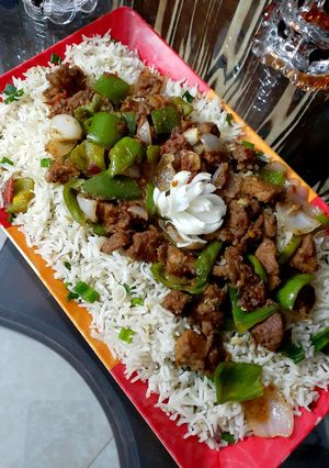 A picture of Beef chilli dry with fried rice.