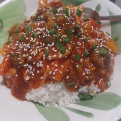 A picture of Sweet & Sour Chicken over Jasmine Rice.