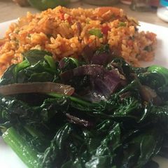 A picture of Fried rice with baby spinach.