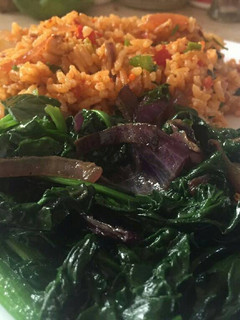 A picture of Fried rice with baby spinach.