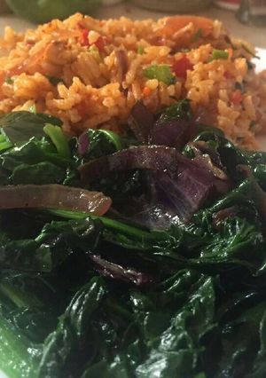 A picture of Fried rice with baby spinach.