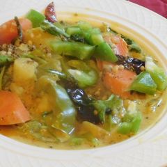 A picture of Colorful masoor dal multi vegetable masala curry/coconut stew.