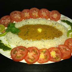 A picture of Daal fry and jeera rice.