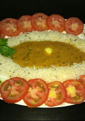 A picture of Daal fry and jeera rice.