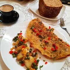 A picture of Masala Breakfast Omelette with sauted vegetable.