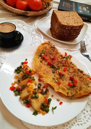 A picture of Masala Breakfast Omelette with sauted vegetable.