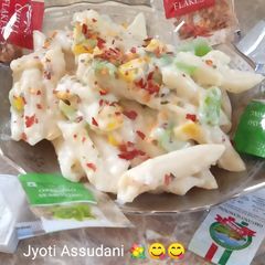 A picture of Italian pasta with white sauce.