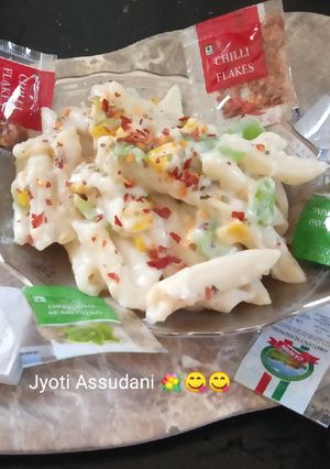 A picture of Italian pasta with white sauce.