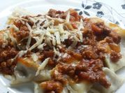 Una foto de salsa bolognesa con carne picada