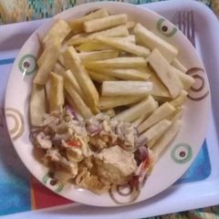 A picture of Fried yam with fried eggs.