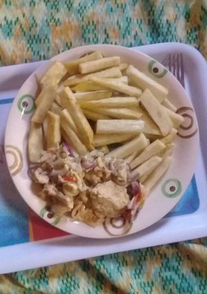 A picture of Fried yam with fried eggs.