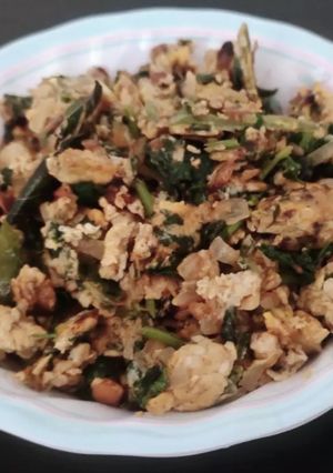 A picture of Brahmi  leaves and egg subji.