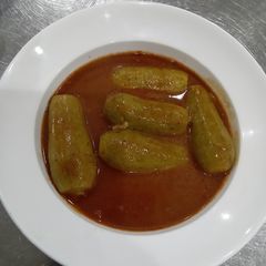 A picture of Stuff kusa - zucchini with red sauce.
