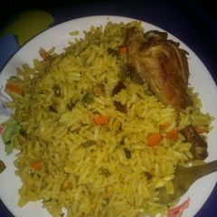 A picture of Fried rice nd chicken.