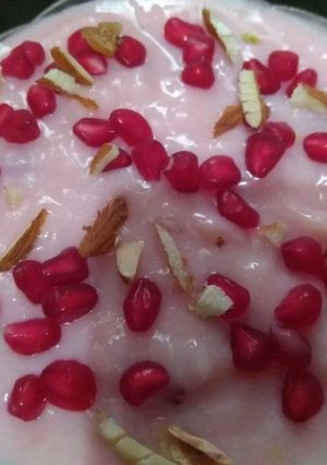 A picture of China Grass Pudding with Chopped nuts and Pomegranate seeds.