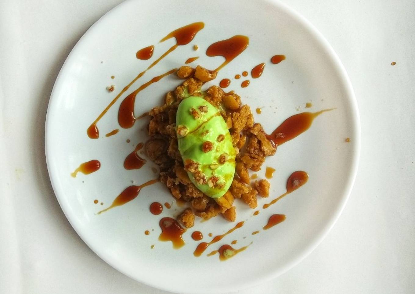 â€œCoffee infused Rasgulla crumbs with pistachio ice cream and coffee syrupâ€