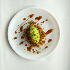 A picture of “Coffee infused Rasgulla crumbs with pistachio ice cream and coffee syrup”.