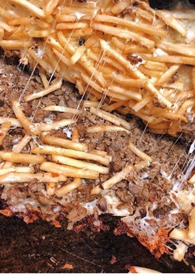 Una foto de Papas cheddar con carne