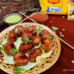 A picture of Red Maggi noodles Momos.