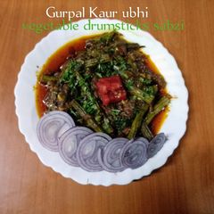A picture of Vegetable drumsticks sabzi 🍅🧅🌶️🧄.