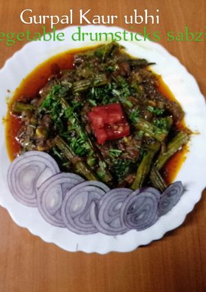 A picture of Vegetable drumsticks sabzi 🍅🧅🌶️🧄.
