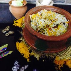 A picture of Chicken smoky Matka biryani.