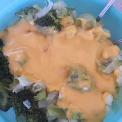 A picture of Broccoli and Cauliflower Cheese with Onions.