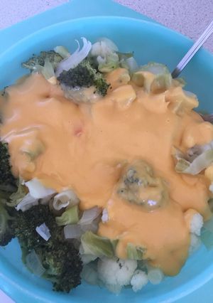 A picture of Broccoli and Cauliflower Cheese with Onions.