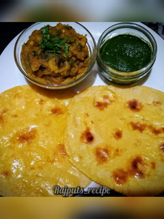 A picture of Makke ki Roti with Baingan ka bharta and Coriander chutney.