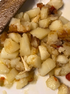 Una foto de Patatas con pimientos rojos